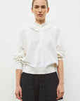 12 FW25 FEUILLE MILK FW26 RIVIERA2 NOIR PROFOND 002 face crop.jpg